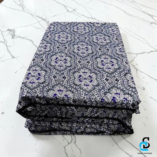 Comfy Support folding mattress cover featuring a blue and white intricate damask pattern on a marble surface