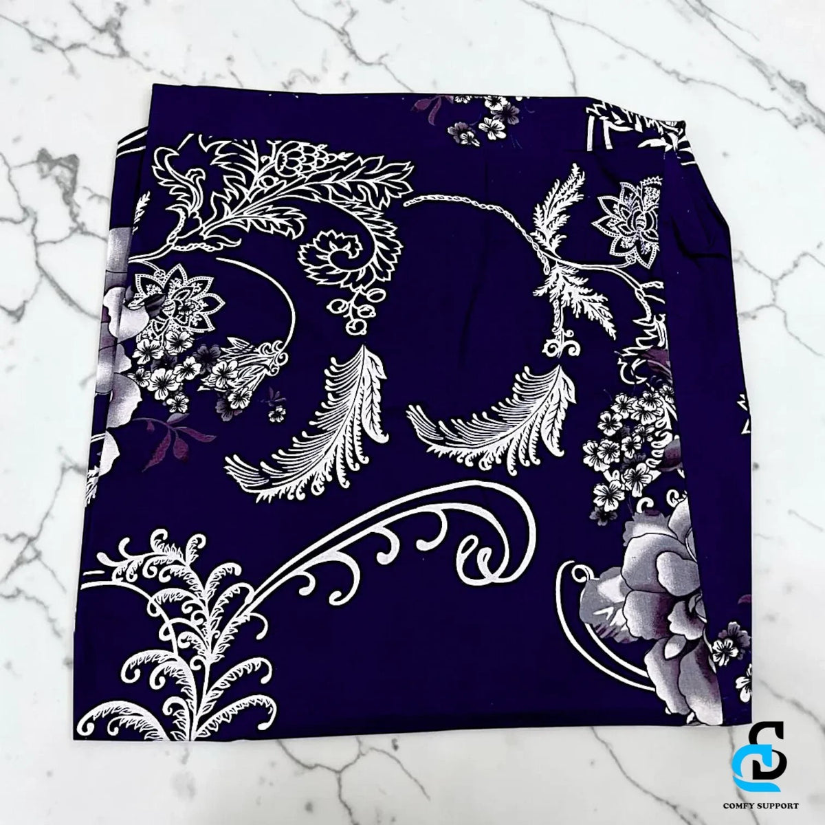 Comfy Support folding mattress cover in a deep purple fabric with an elegant white floral and botanical print